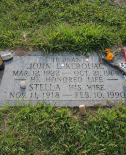 Gravestone of Jack Kerouac with items left by admirers