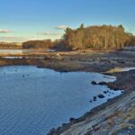 body of water, low with muddy shore, trees