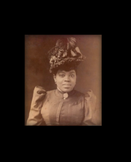 Formal photo of Sissieretta Jones with formal hat. Leader or The Black Patti Troubadours in late 1800s