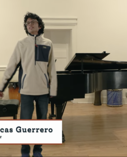 Singer in front of piano