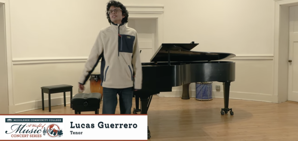 Singer in front of piano