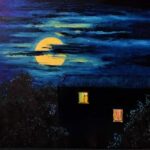a house late at night with light coming from the windows