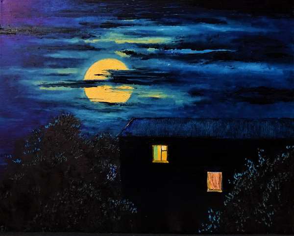 a house late at night with light coming from the windows
