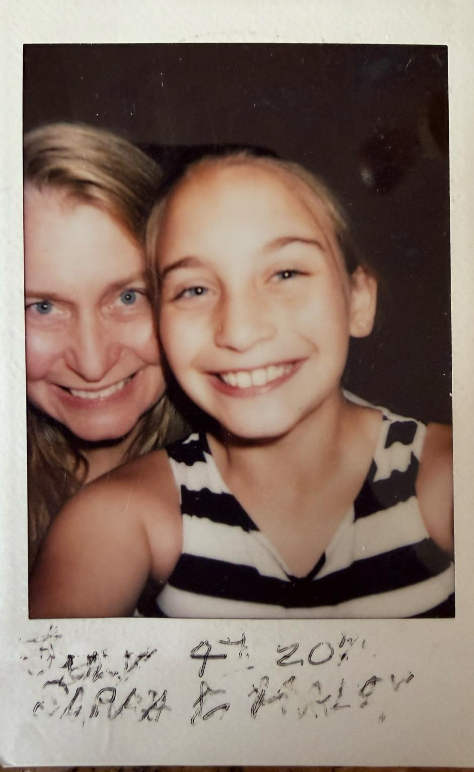 a polaroid of a mother and daughter